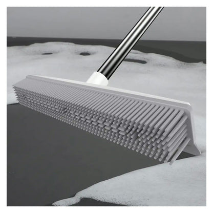 Squeegee edge pushing water on a hard floor